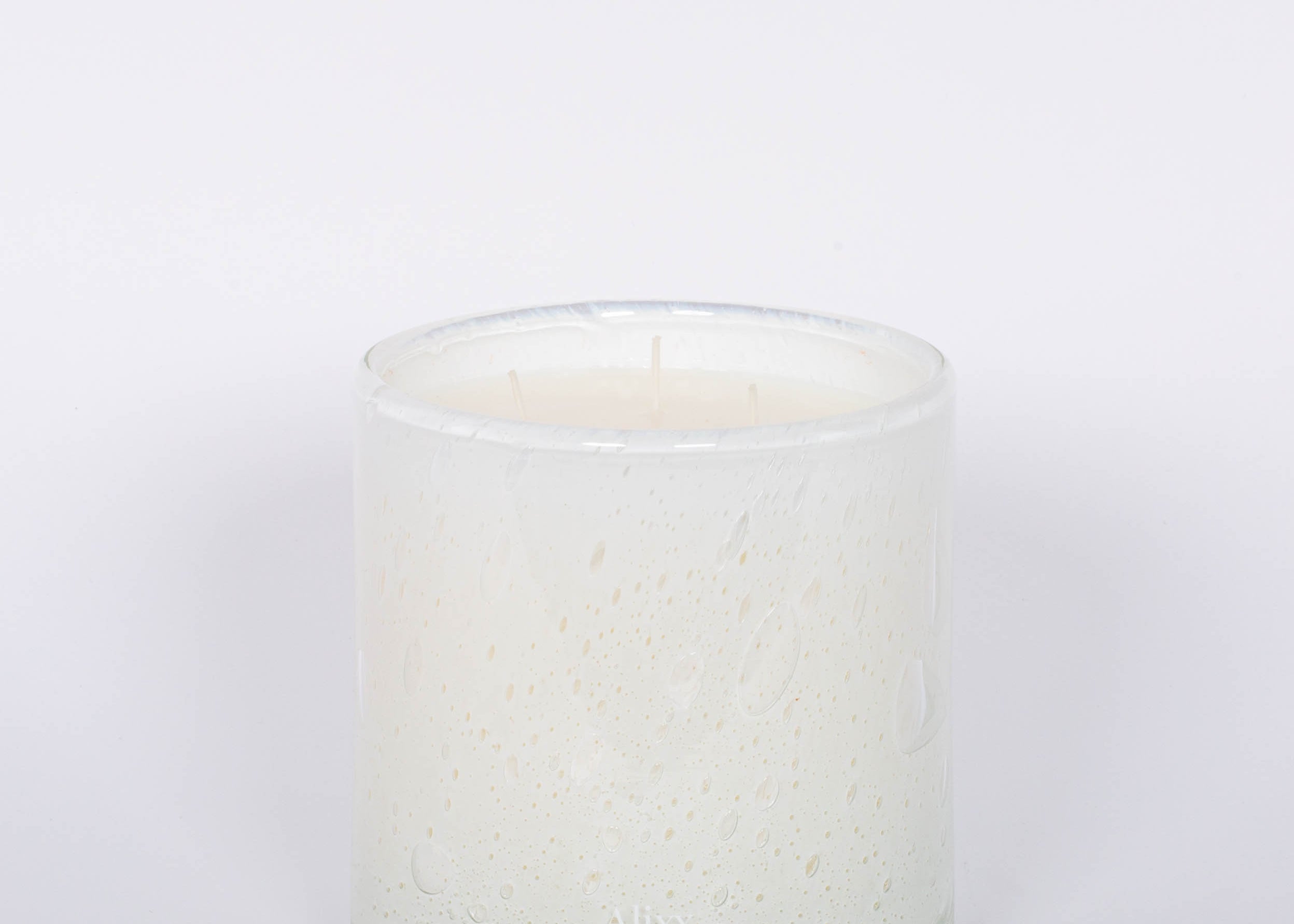 Fleur Blanche Cylindre white bubble glass candle by Alixx with moonflower and violet aroma. White background.