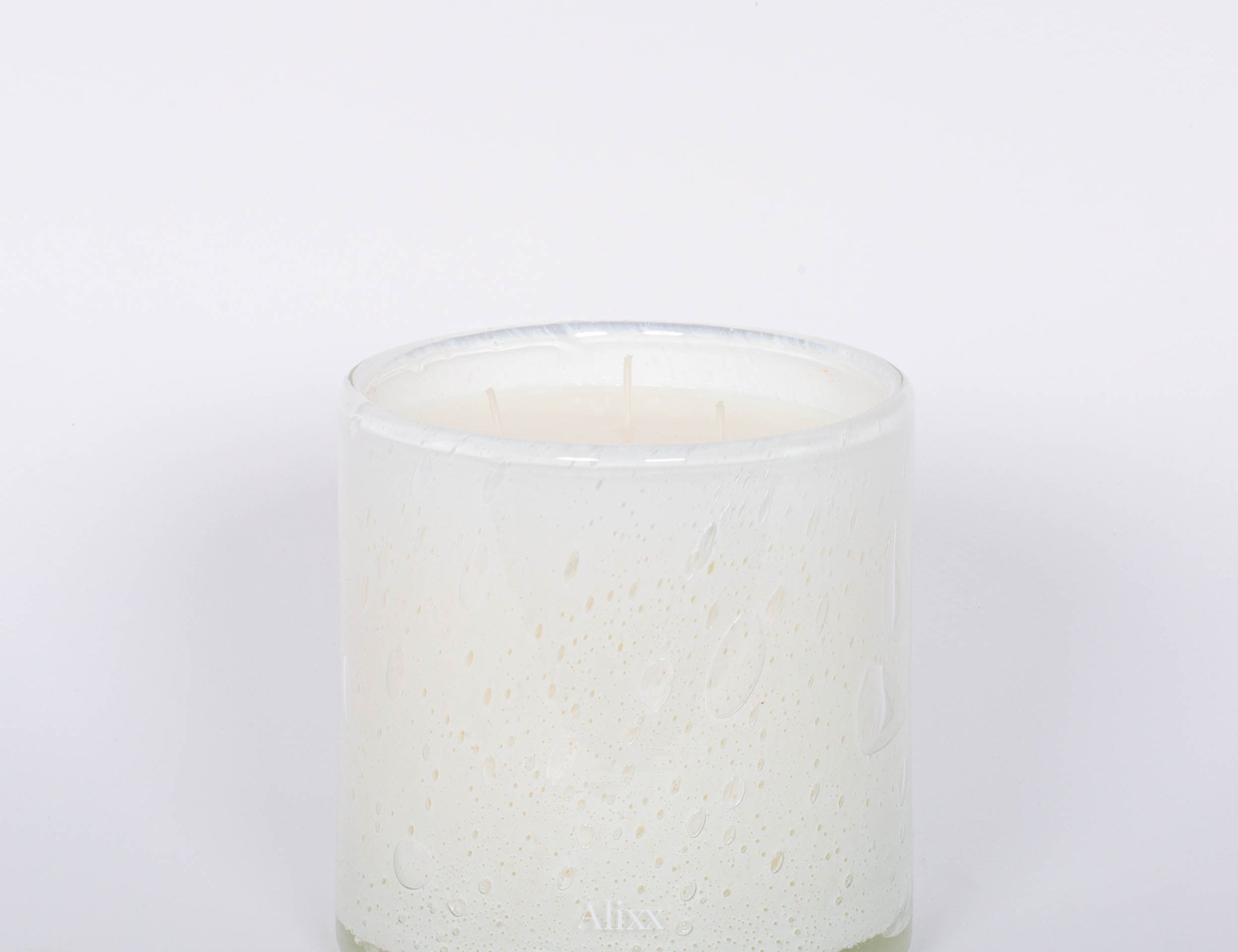 Fleur Blanche Cylindre white bubble glass candle by Alixx with moonflower and violet aroma. White background.