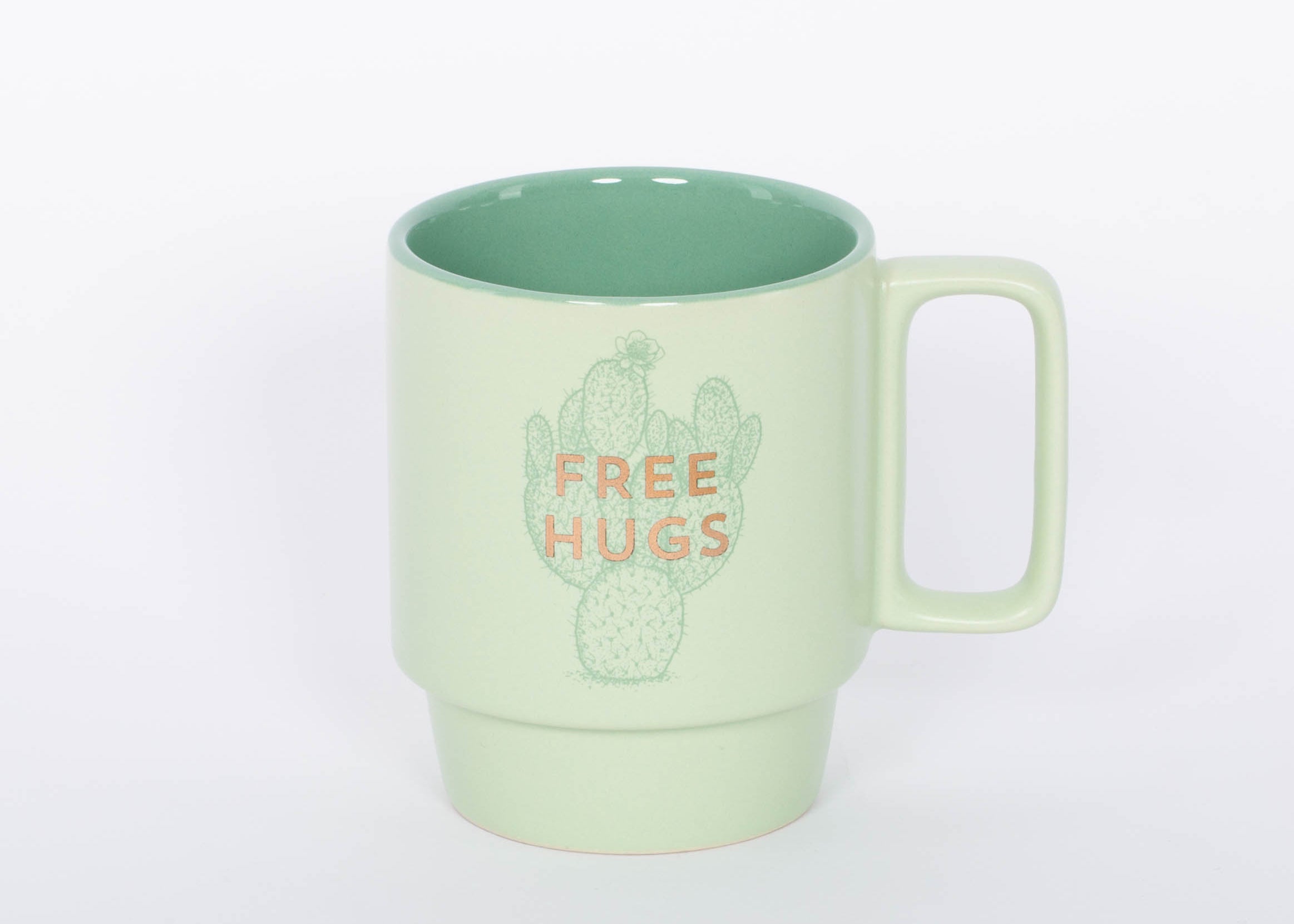 Free Hugs Mug. Crafted of high-quality ceramic, this stackable mug features a sassy sentiment in metallic gold lettering. This 12 oz. cactus mug is the perfect companion to your morning routine whether it's for a cup of coffee, hot cocoa, or tea. It also makes a great gift for the plant lover in your life!