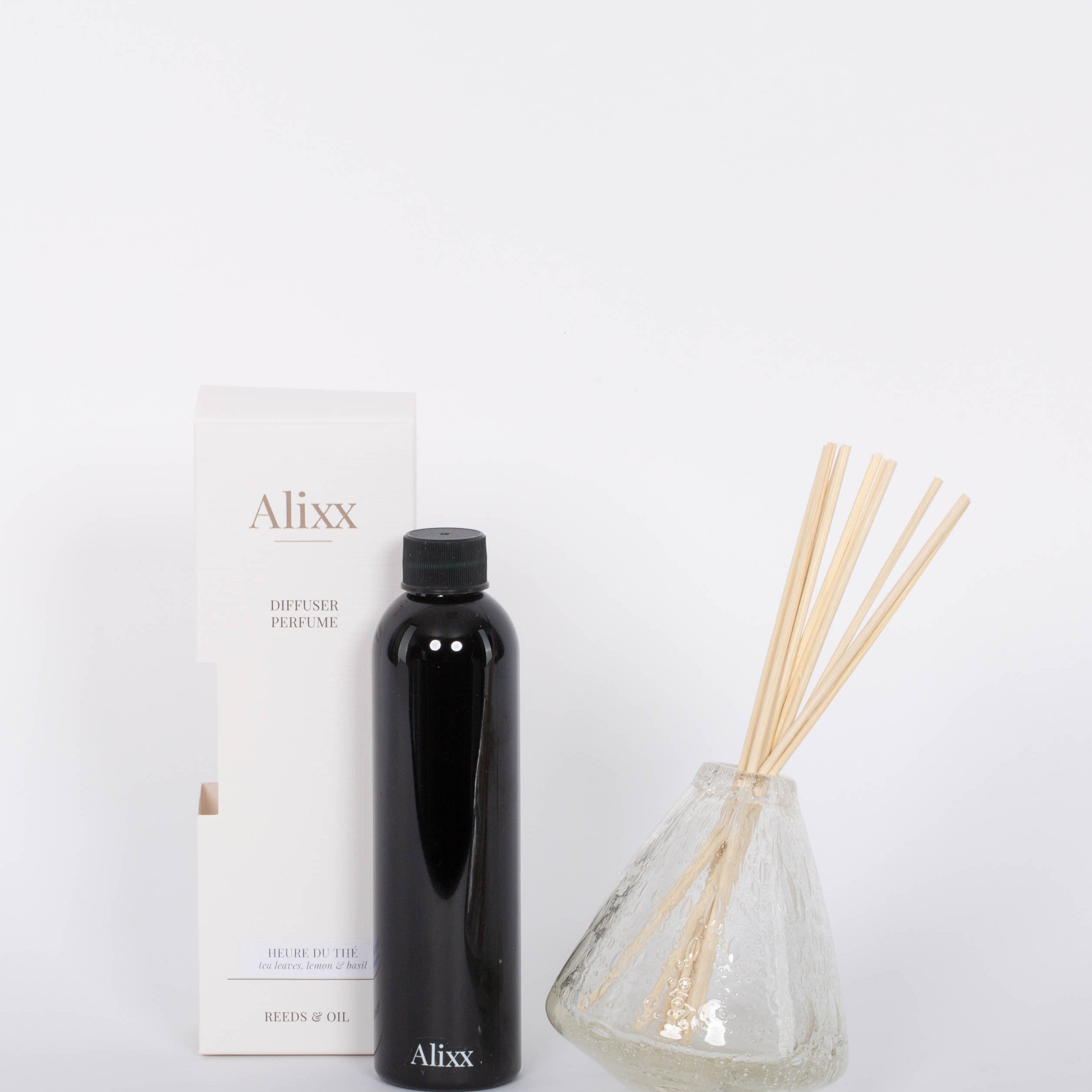 Heure du Thé Diffuser Set by Alixx with vase, scent sticks, and refill bottle. White background. 