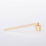 Minimal Golden Candle Snuffer by Designworks. White background.