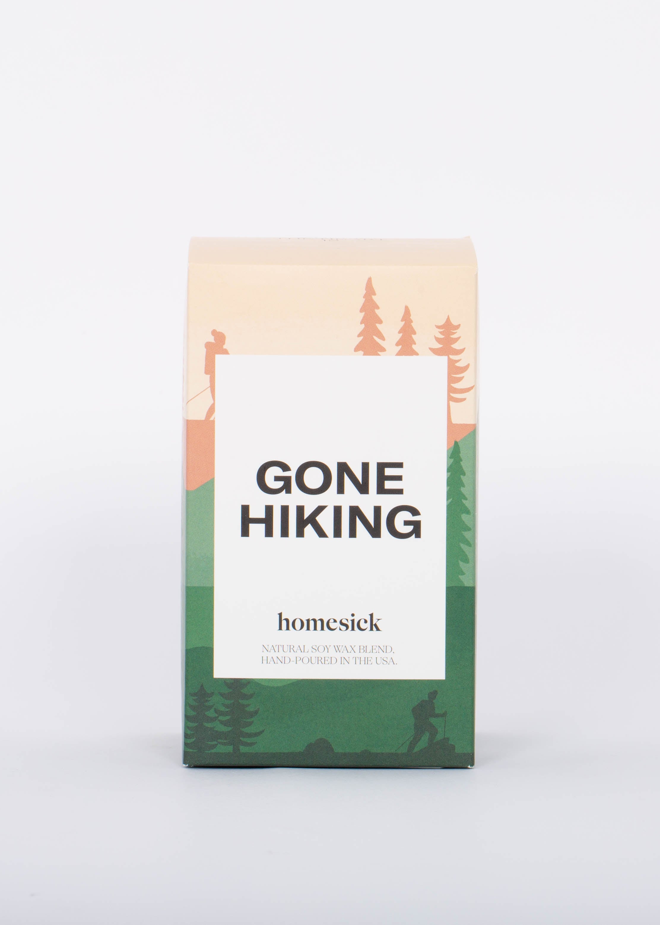 Gone Hiking candle box with pink and green hiking and forest illustration and white label with bold "GONE HIKING" label. 