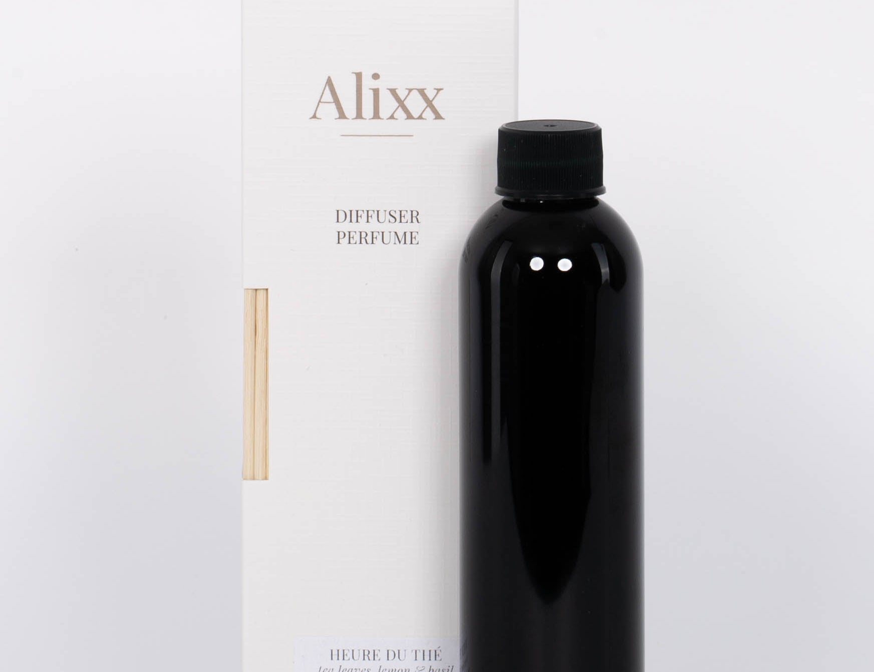 Alixx Heure du The Diffuser Refill with lemon, basil, and musk in a dark bottle and white packaging.