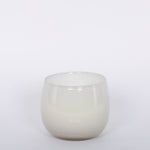 16oz Heure du Thé Ballon candle by Alixx in white. Lily of the valley, water cedar, and musk fragrance. White background.