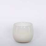 16oz Heure du Thé Ballon candle by Alixx in white. Lily of the valley, water cedar, and musk fragrance. White background.