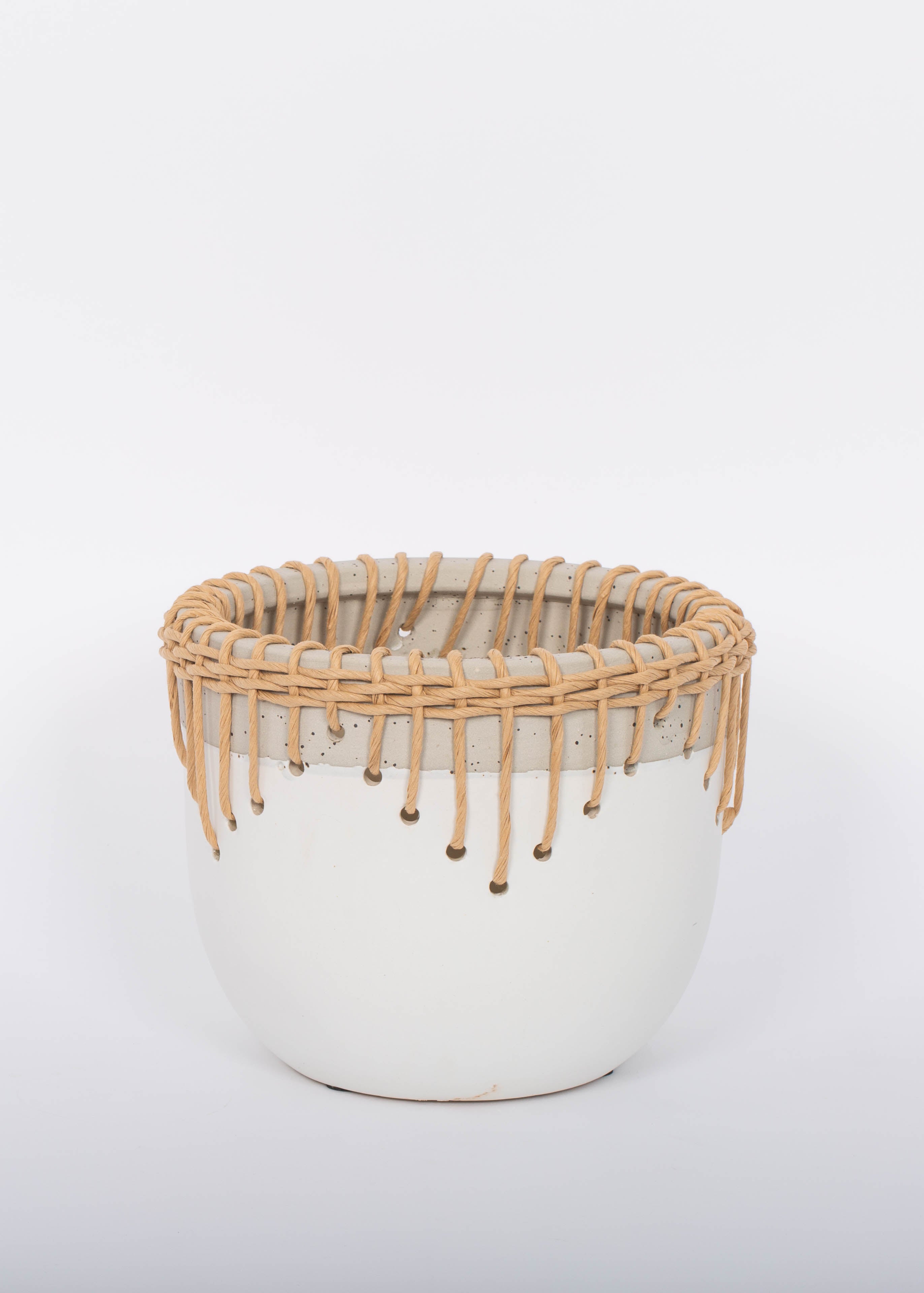 White Hideaway Pot with two tone neutral base and woven rattan detailing around top rim.  White background.