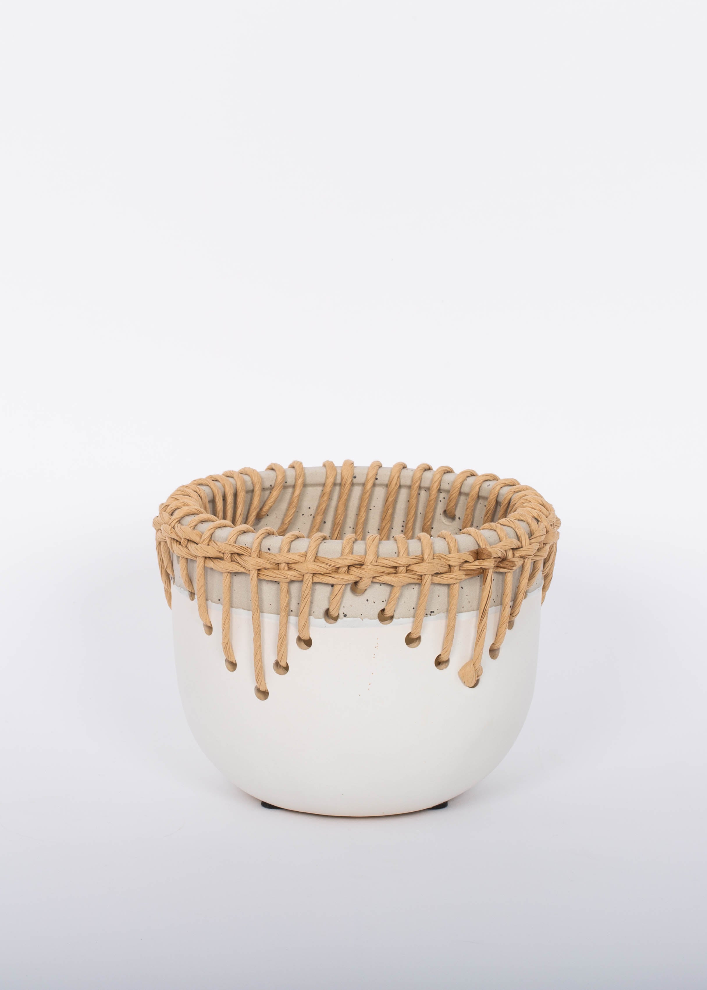 White Hideaway Pot with two tone neutral base and woven rattan detailing around top rim.  White background.