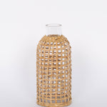 Jaxon Caraffe rattan covered glass vase in neutral light basket tone.  White background.