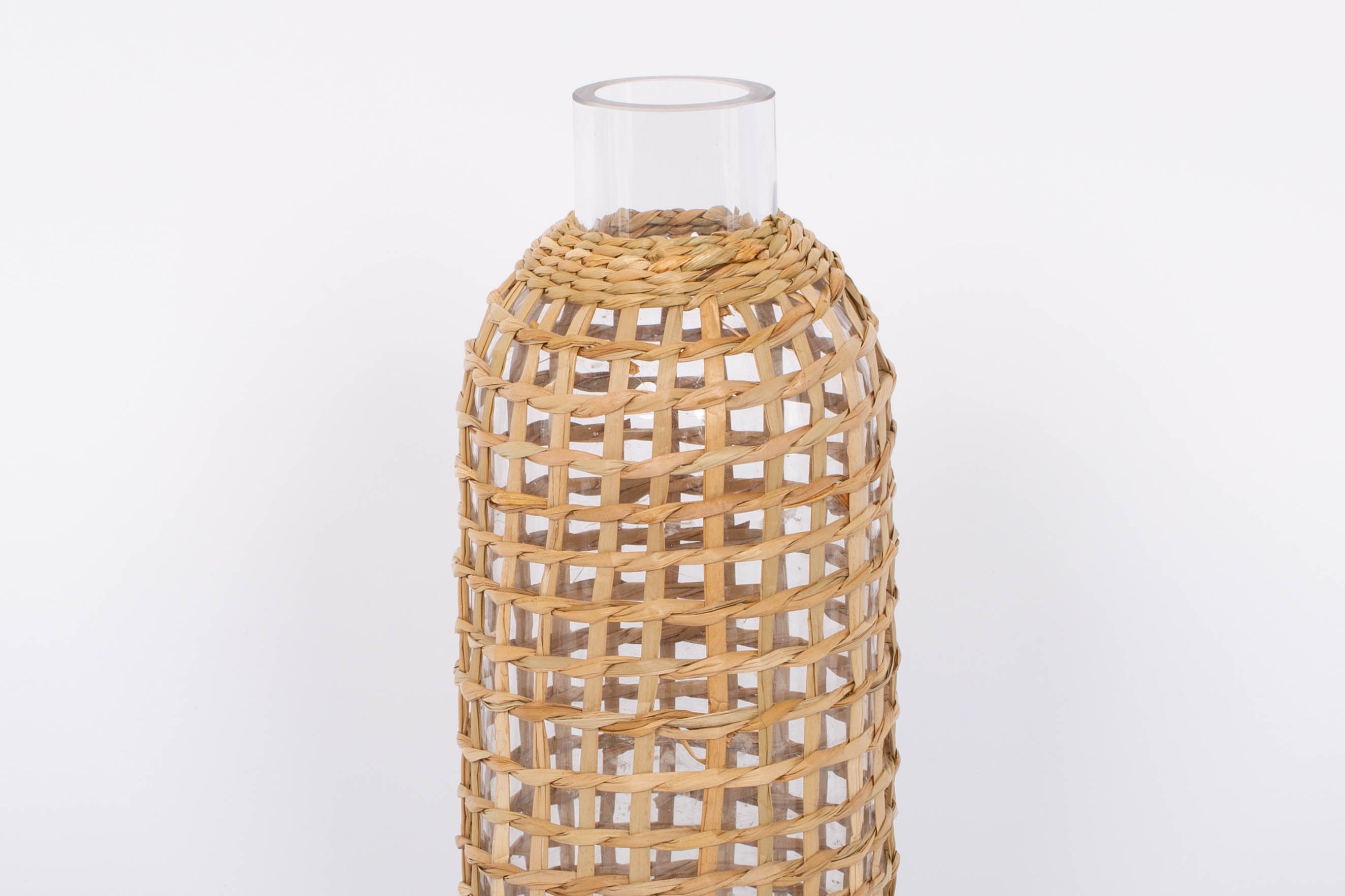 Jaxon Caraffe rattan covered glass vase in neutral light basket tone.  White background.