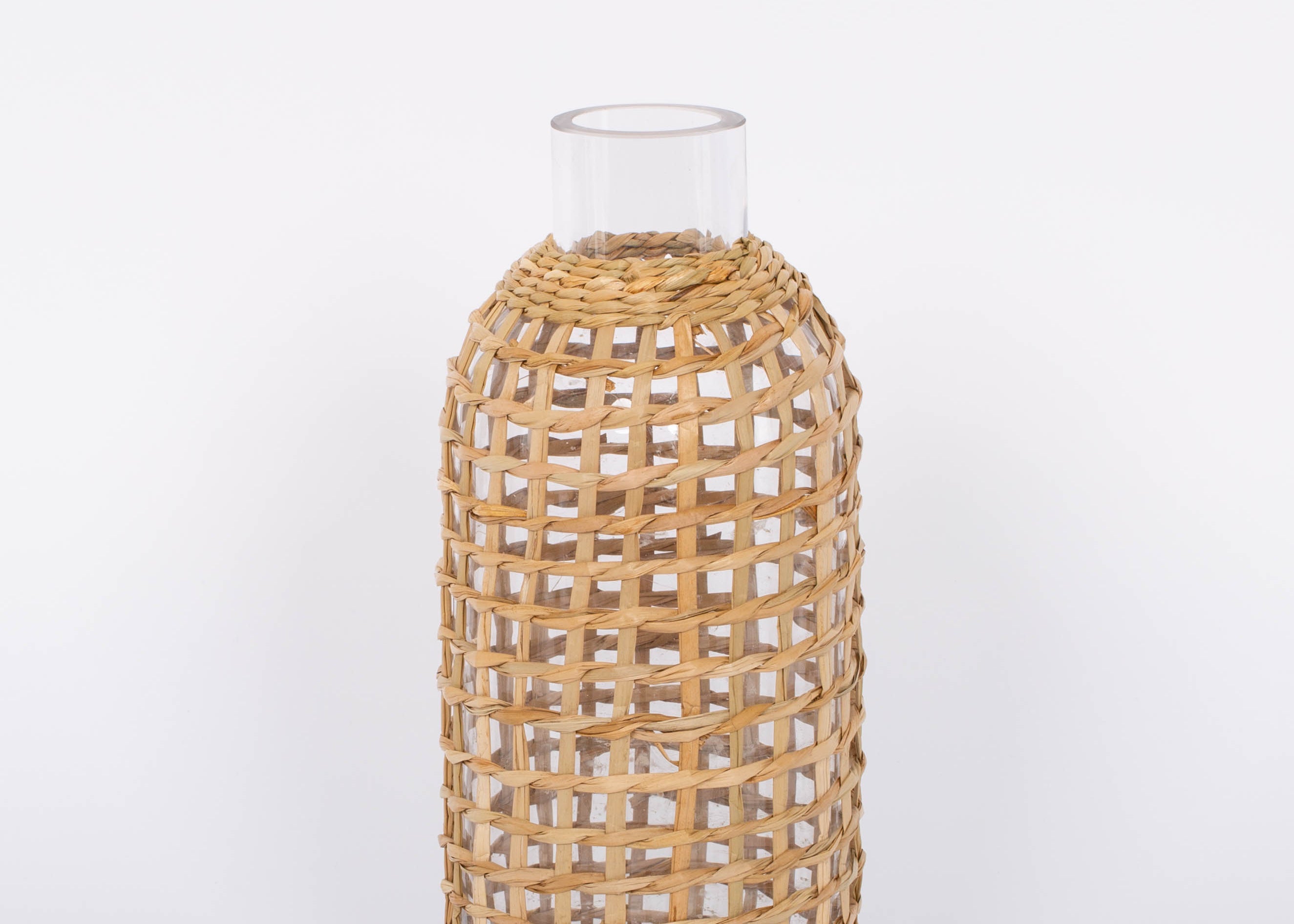 Jaxon Caraffe rattan covered glass vase in neutral light basket tone.  White background.