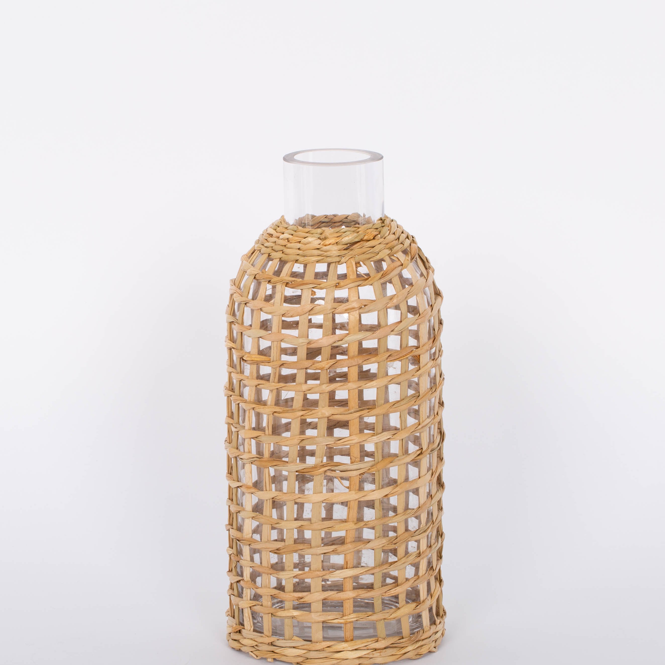 Jaxon Caraffe rattan covered glass vase in neutral light basket tone.  White background.