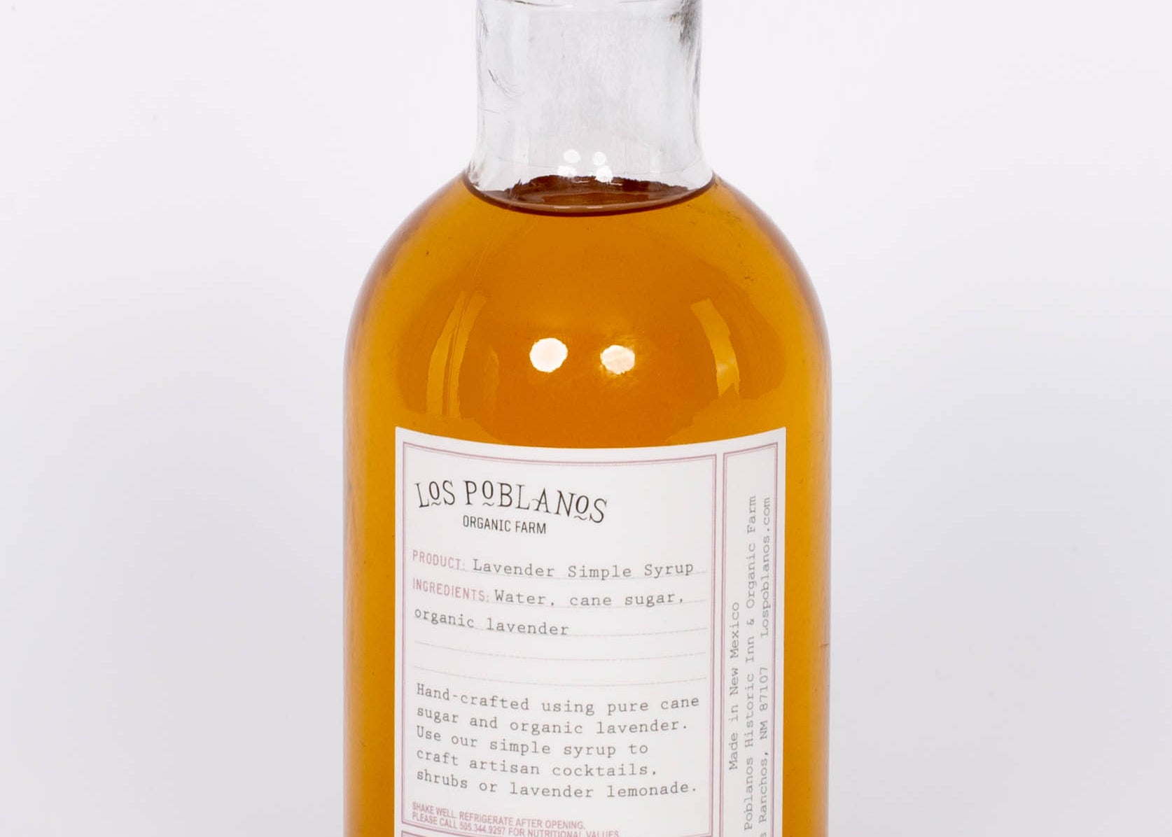 Golden Lavender Simple Syrup by Los Poblanos in glass bottle with gold cap. 