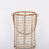 Glass Lieto Lantern with rattan exterior and handle in natural light wood tone. White background. 