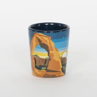 Minimalist Moab shot glass with Delicate Arch in layered desert tones