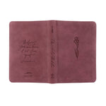 Pink leather-bound book with embossed text and a flower design on a white background