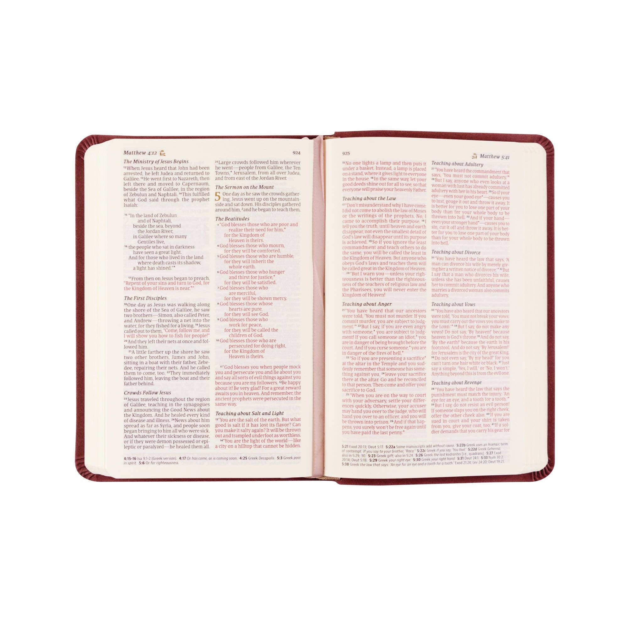 Open book with red cover on a white background
