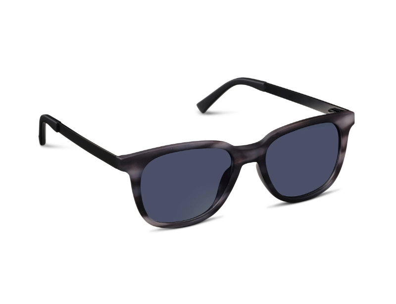Sunglasses with dark lenses and black frame on a white background