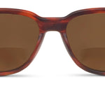Sunglasses with tortoiseshell frame and brown lenses on a white background