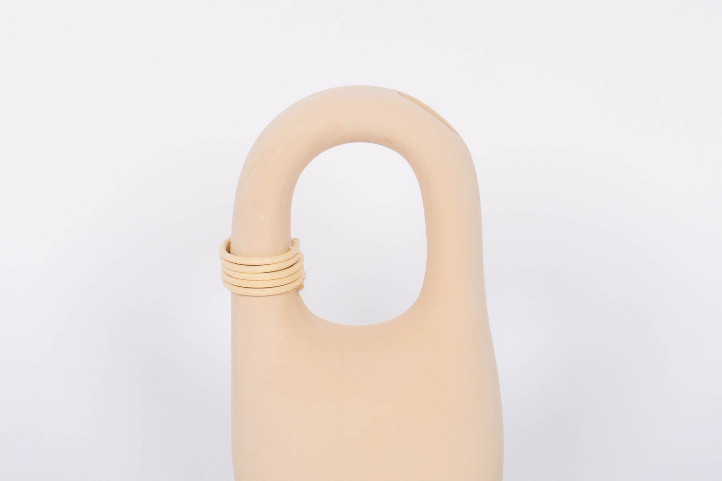Palau Tan Vase matte finish with natural bisque cermaic, unique handle feature and wrapped rattan coil. White background.