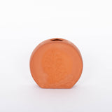 Short round Poppy Budvase in terracotta geometric silhouette with imprint of live plant. White background.