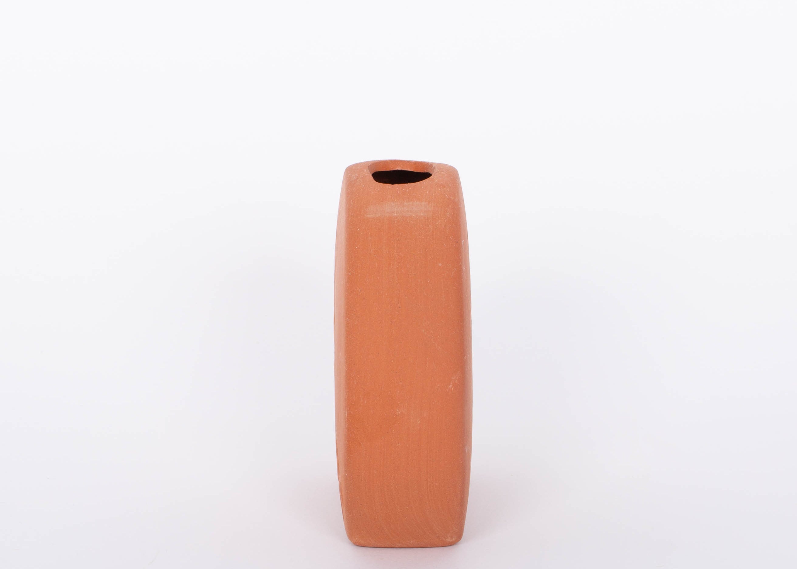 Short round Poppy Budvase in terracotta geometric silhouette with imprint of live plant. Side view. White background.