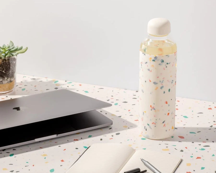 Terrazzo Cream Porter Water Bottle Your go-to reusable glass bottle helps you ditch the plastic and upgrade your hydration game.  Reduce. Reuse. Refill.