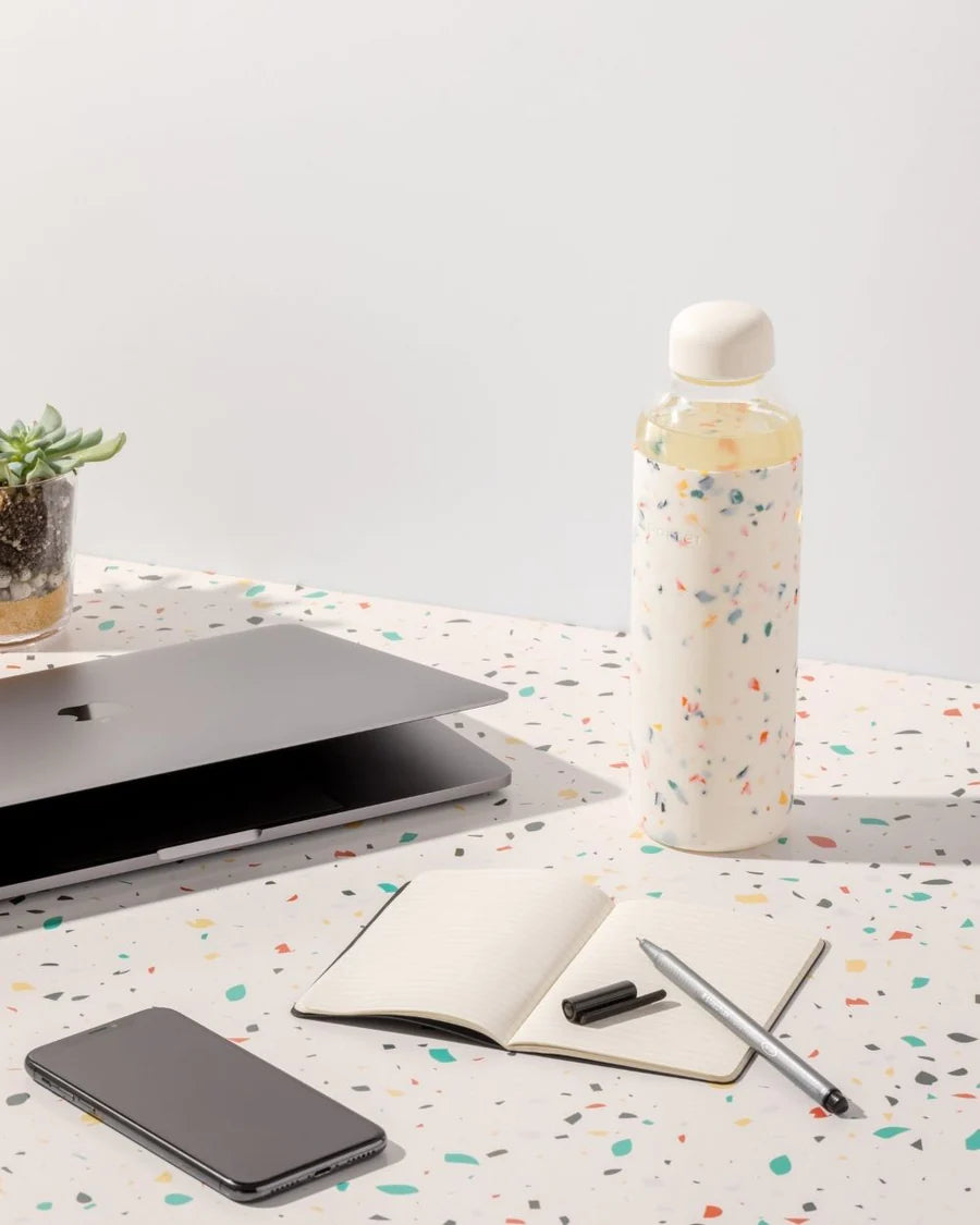 Terrazzo Cream Porter Water Bottle Your go-to reusable glass bottle helps you ditch the plastic and upgrade your hydration game.  Reduce. Reuse. Refill.