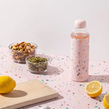 Terrazzo Blush Porter Waterbottle Your go-to reusable glass bottle helps you ditch the plastic and upgrade your hydration game.  Reduce. Reuse. Refill. 