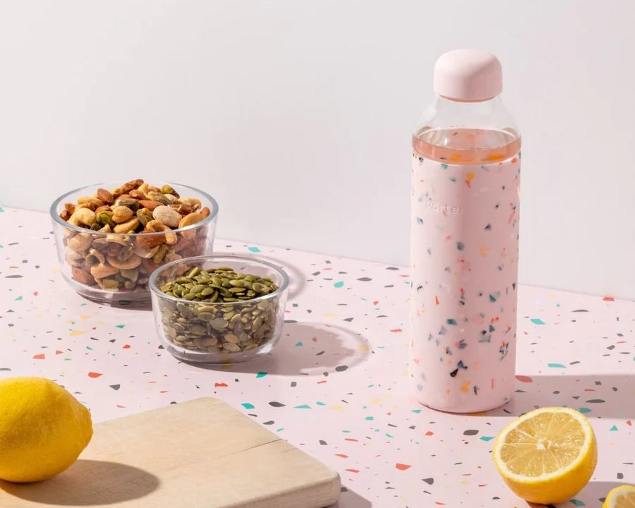 Terrazzo Blush Porter Waterbottle Your go-to reusable glass bottle helps you ditch the plastic and upgrade your hydration game.  Reduce. Reuse. Refill. 