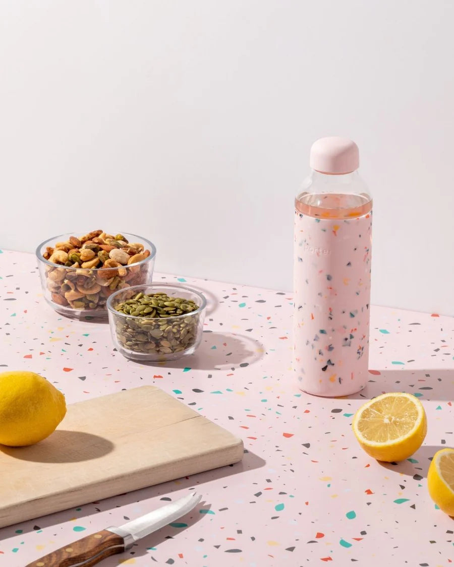 Terrazzo Blush Porter Waterbottle Your go-to reusable glass bottle helps you ditch the plastic and upgrade your hydration game.  Reduce. Reuse. Refill. 