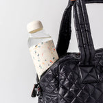 Terrazzo Cream Porter Water Bottle Your go-to reusable glass bottle helps you ditch the plastic and upgrade your hydration game.  Reduce. Reuse. Refill.