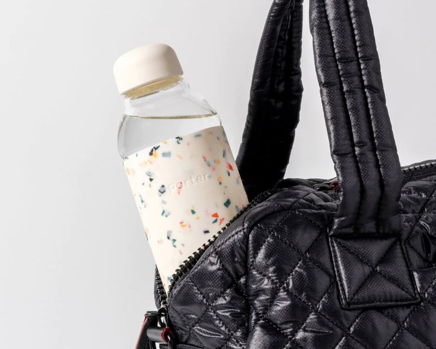 Terrazzo Cream Porter Water Bottle Your go-to reusable glass bottle helps you ditch the plastic and upgrade your hydration game.  Reduce. Reuse. Refill.