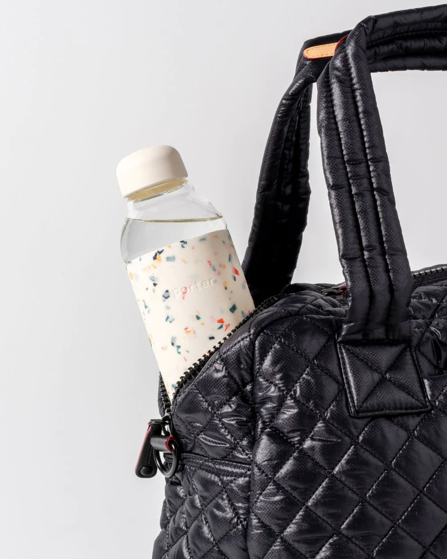 Terrazzo Cream Porter Water Bottle Your go-to reusable glass bottle helps you ditch the plastic and upgrade your hydration game.  Reduce. Reuse. Refill.