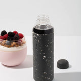 Terrazzo Charcoal Porter Waterbottle Your go-to reusable glass bottle helps you ditch the plastic and upgrade your hydration game.  Reduce. Reuse. Refill. 