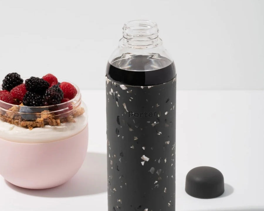 Terrazzo Charcoal Porter Waterbottle Your go-to reusable glass bottle helps you ditch the plastic and upgrade your hydration game.  Reduce. Reuse. Refill. 