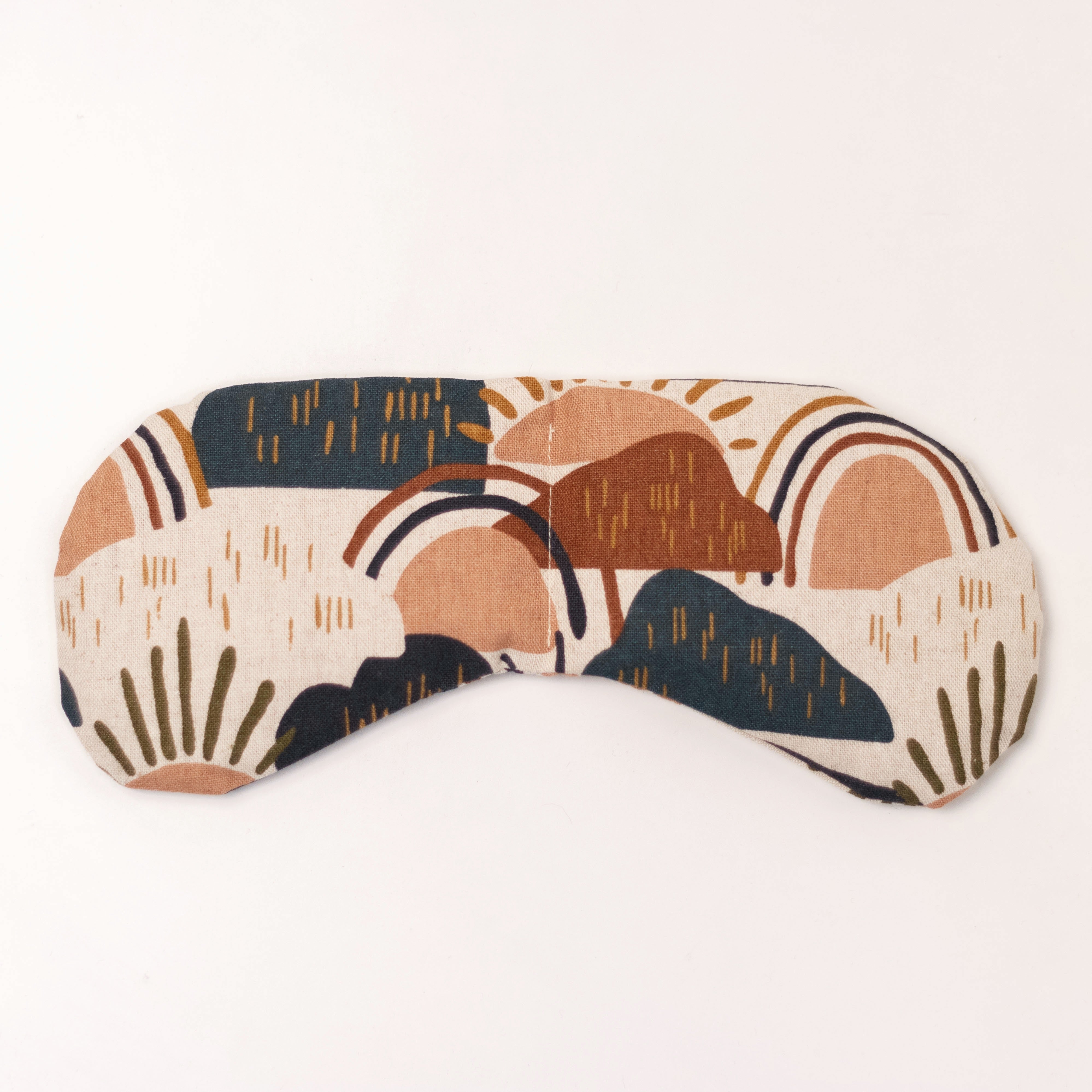 Migraine Mask by Slow North. Strap free cotton weighted eye pillow to be used hot or cold to sooth headaches and tired eyes. Tan, maroon, and navy rainstorm design. White background.