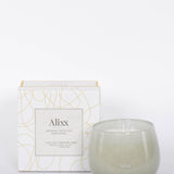 Paris inspired Salon De Tabac white two wick candle by Alixx with earthy oak wood, warm bourbon, and sweet plum nectar fragrance.  White and gold packaging box.