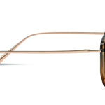 Sunglasses with gold frame and dark lenses on a white background