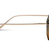 Sunglasses with gold frame and dark lenses on a white background