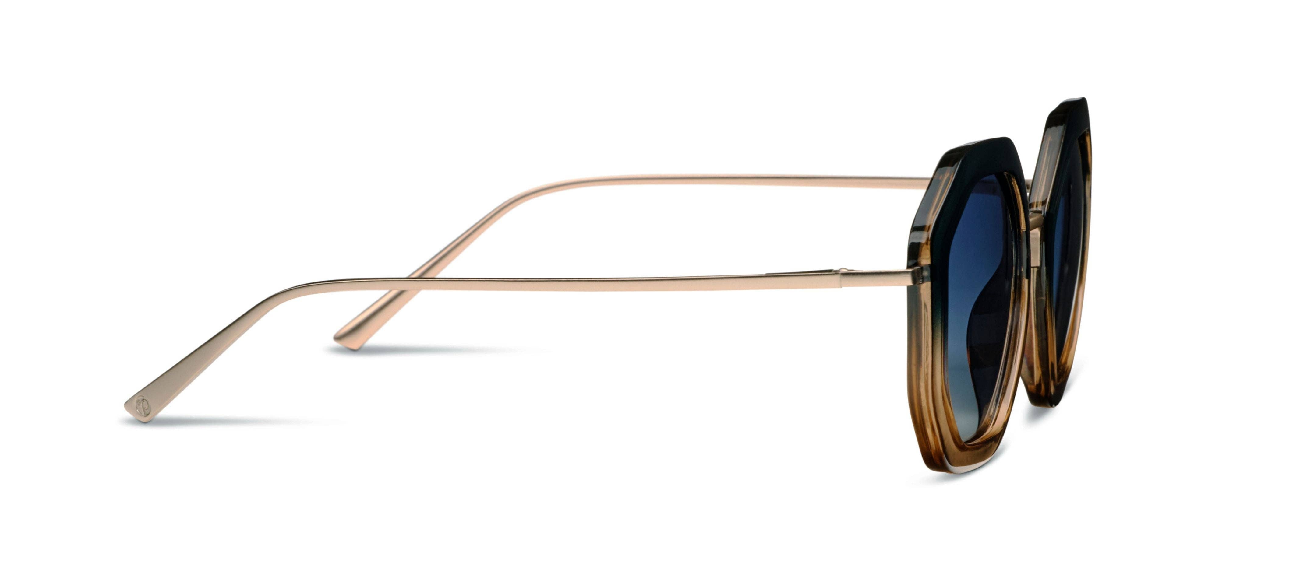 Sunglasses with gold frame and dark lenses on a white background