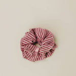 Striped scrunchie on a beige background