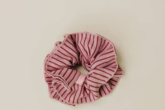 Striped scrunchie on a beige background