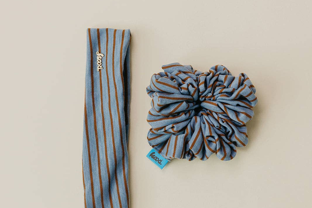 Striped headband and scrunchie set on a beige background