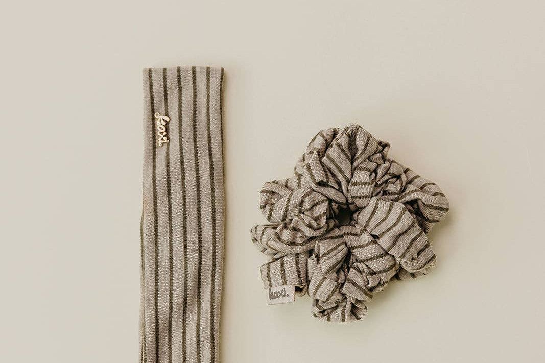 Striped headband and scrunchie set on a beige background