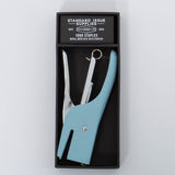 Light blue and silver Standard Issue Stapler by Designworks in black packaging bog with 1000 staples. 