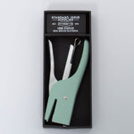 Vintage green and silver Standard Issue Stapler by Designworks in black packaging bog with 1000 staples. 