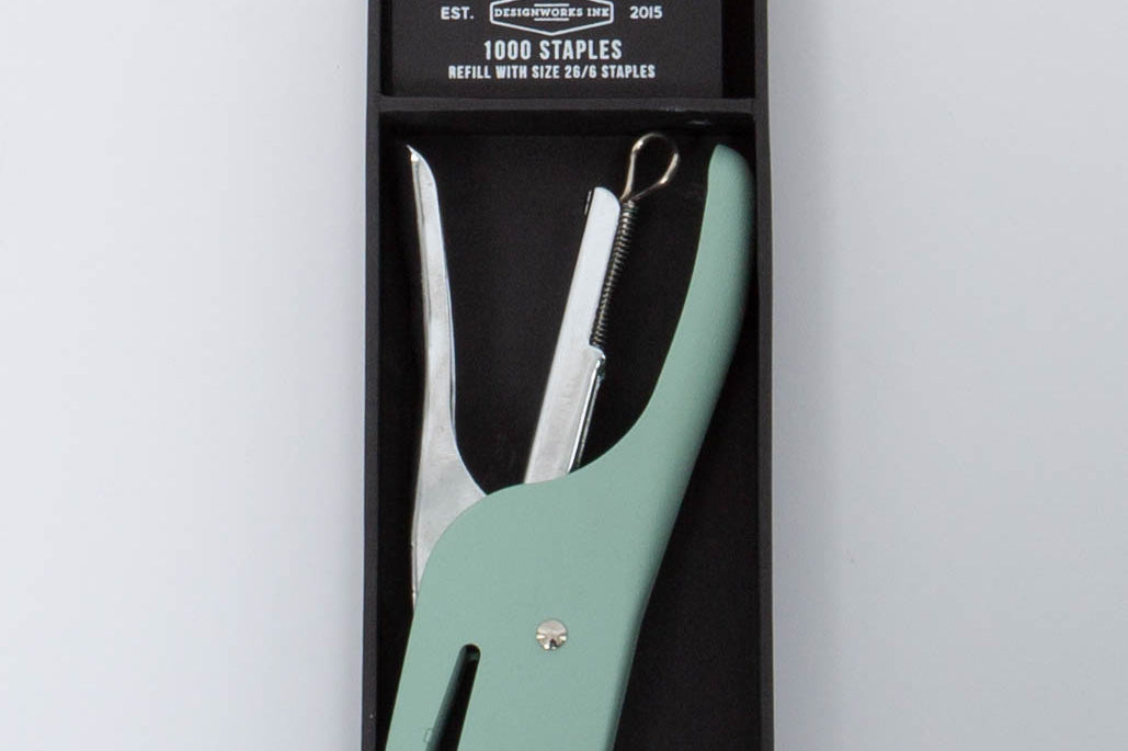 Vintage green and silver Standard Issue Stapler by Designworks in black packaging bog with 1000 staples. 