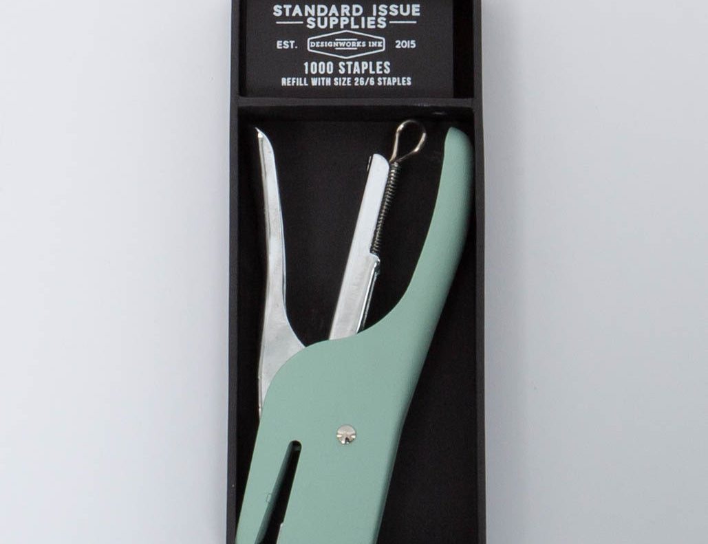 Vintage green and silver Standard Issue Stapler by Designworks in black packaging bog with 1000 staples. 