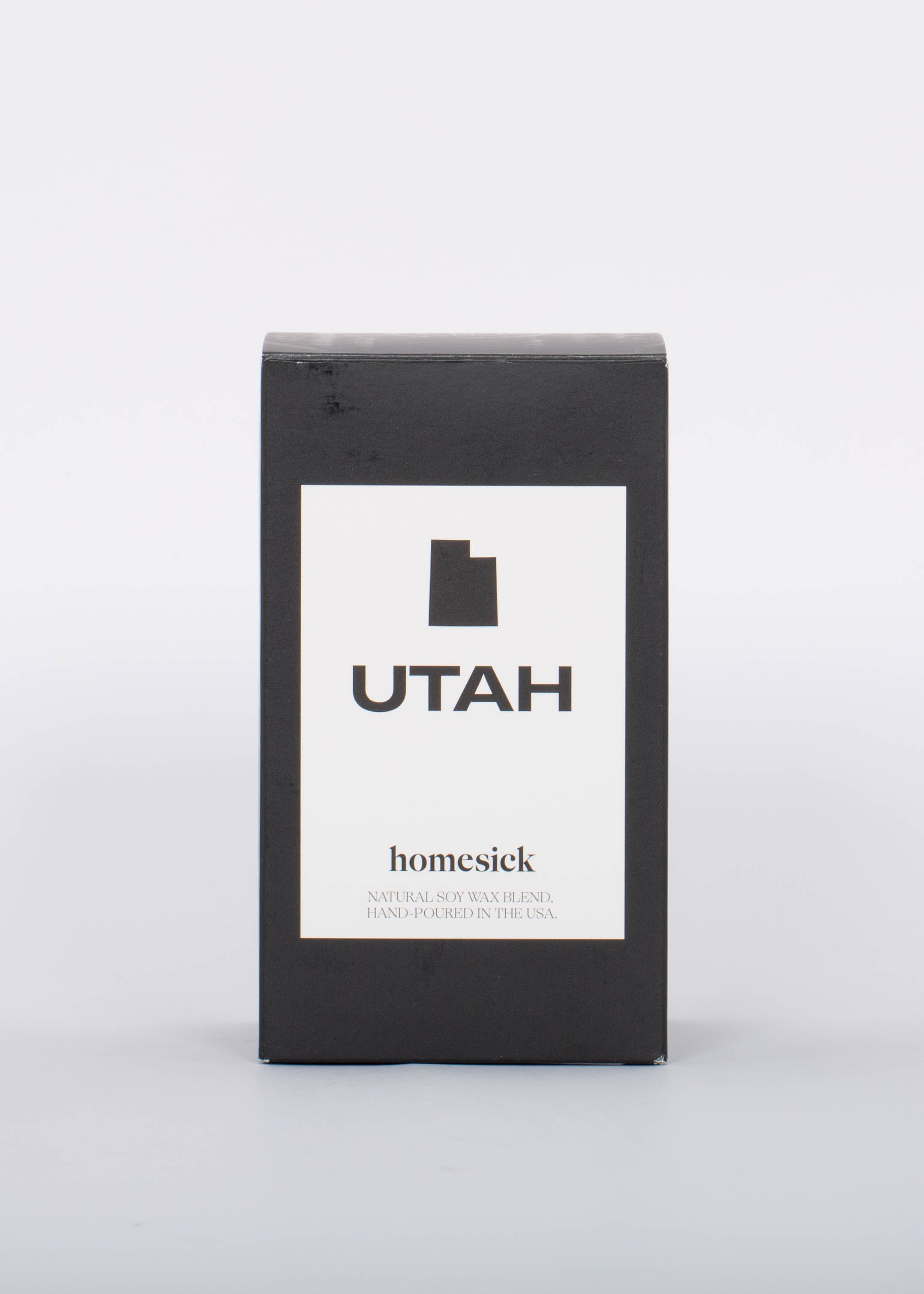 Black box with white label and black Utah outline for soy wax hand poured Utah Candle by Homesick.