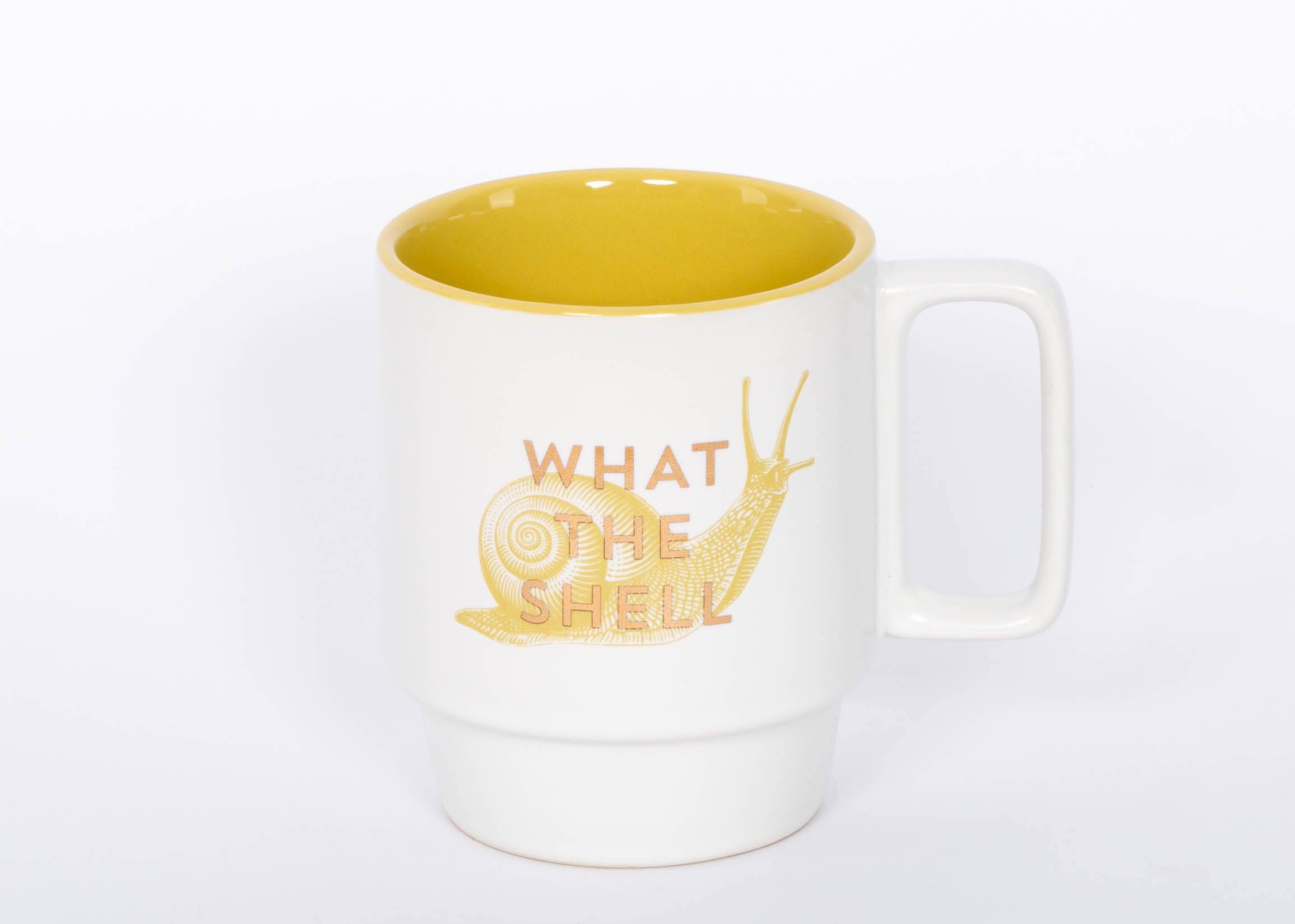 What the Shell Mug. This 12 oz. snail mug is the perfect companion to your morning routine whether it's for a cup of coffee, hot cocoa, or tea. It also makes a great gift for the witty friend or family member in your life!  3.25" D X 4.125" H 12 Oz Stackable Ceramic Mug Cute Snail Illustration Metallic Gold Foil Accent